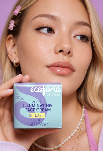 Woman holding ecoforia face cream box against a purple background